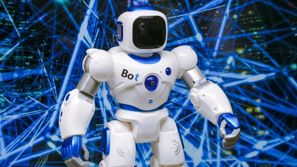 Futuristic humanoid robot with glowing blue accents against a digital network background, symbolizing Meta's new open-weight AI model Muse Spark Open